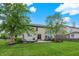 Expansive backyard with lush green grass, a patio area, and beautiful landscaping for outdoor enjoyment at 9179 Brookstone Pl, Zionsville, IN 46077