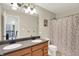 Bathroom with a double vanity, tub/shower combination, and cheerful decor at 9179 Brookstone Pl, Zionsville, IN 46077