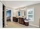 Spacious bathroom with double vanity, natural light, and closet access at 9179 Brookstone Pl, Zionsville, IN 46077