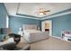 Bright bedroom with large windows, neutral carpet, and an ensuite bathroom access at 9179 Brookstone Pl, Zionsville, IN 46077