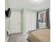 Bright bedroom with a closet with sliding doors, and a window view at 9179 Brookstone Pl, Zionsville, IN 46077