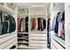 Organized walk-in closet with shelving and ample storage space for clothing and accessories at 9179 Brookstone Pl, Zionsville, IN 46077