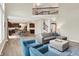 Open concept living room showing high ceilings with hardwood floors, open to the kitchen area at 9179 Brookstone Pl, Zionsville, IN 46077