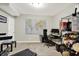 Cozy home office featuring a world map, desk setup, and storage for optimal productivity at 9179 Brookstone Pl, Zionsville, IN 46077