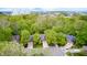 Overhead shot of homes nestled within a lush canopy of vibrant green trees at 9324 W Point Pl, Indianapolis, IN 46268
