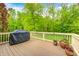 Relax on the spacious back deck with seasonal views and wrought iron railing at 9324 W Point Pl, Indianapolis, IN 46268