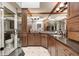 Elegant bathroom boasts rich wood cabinets, granite countertops, and a modern glass shower at 9324 W Point Pl, Indianapolis, IN 46268