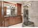 Stylish bathroom featuring custom cabinetry, granite countertops, and a frameless glass shower at 9324 W Point Pl, Indianapolis, IN 46268
