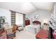 Cozy bedroom features a vaulted ceiling, plush bedding, and a charming sitting area at 9324 W Point Pl, Indianapolis, IN 46268