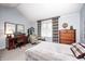 Inviting bedroom with a comfortable seating area, natural light, and neutral decor at 9324 W Point Pl, Indianapolis, IN 46268