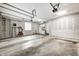 Spacious garage with overhead storage, window, and plenty of room for parking at 9324 W Point Pl, Indianapolis, IN 46268