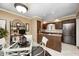 Eat-in kitchen offers stainless appliances, granite counters, and a glass table with seating at 9324 W Point Pl, Indianapolis, IN 46268