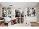 Bright living area with built-in bookshelves, plush seating, and view into the next room at 9324 W Point Pl, Indianapolis, IN 46268