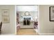 View through doorway of a comfortable living room featuring a fireplace and stylish decor at 9324 W Point Pl, Indianapolis, IN 46268