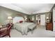 Bright main bedroom showcasing neutral walls, plush carpet, and a comfortable seating area at 9324 W Point Pl, Indianapolis, IN 46268