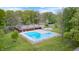 Aerial view of a refreshing pool surrounded by lush greenery and lounge chairs at 9324 W Point Pl, Indianapolis, IN 46268
