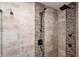 Modern shower showcasing sleek fixtures, elegant neutral tiling, and a rainfall showerhead at 9324 W Point Pl, Indianapolis, IN 46268