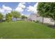 Large, grassy backyard with a storage shed and partial fencing offering ample space for outdoor activities at 1008 Canary Creek Ct, Franklin, IN 46131
