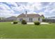 Well-maintained backyard with a lush lawn and concrete patio, providing a serene outdoor setting at 1008 Canary Creek Ct, Franklin, IN 46131