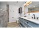 Modern bathroom featuring double vanity sinks, modern hardware, and tiled floors at 1008 Canary Creek Ct, Franklin, IN 46131