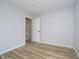 Clean bedroom with wood-look flooring and a bright white closet, providing a simple and comfortable space at 1008 Canary Creek Ct, Franklin, IN 46131