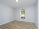 Unfurnished room features a hardwood floor and a large window that brings in ample natural light at 1008 Canary Creek Ct, Franklin, IN 46131