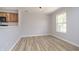 Bright dining area next to kitchen featuring modern lighting and updated flooring at 1008 Canary Creek Ct, Franklin, IN 46131