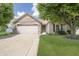 Charming single-story brick home with an attached garage and a well-manicured front yard at 1008 Canary Creek Ct, Franklin, IN 46131