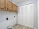 Functional laundry room features ample storage and a convenient laundry hook-up at 1008 Canary Creek Ct, Franklin, IN 46131
