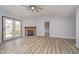 Cozy living room showcasing a fireplace and double doors leading to the backyard at 1008 Canary Creek Ct, Franklin, IN 46131