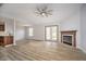 Open living area with fireplace, fan, and doors to the backyard at 1008 Canary Creek Ct, Franklin, IN 46131