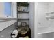 Bright bathroom featuring subway tile, floating shelves, and stylish decor at 108 E Saint Clair St # E, Indianapolis, IN 46204