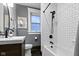 Stylish bathroom featuring a shower, black fixtures, and subway tile, offering a modern look at 108 E Saint Clair St # E, Indianapolis, IN 46204