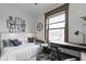 Well-lit bedroom with a comfortable bed and a desk at 108 E Saint Clair St # E, Indianapolis, IN 46204