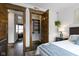 Bedroom featuring a view into the living room and a closet, offering convenience and style at 108 E Saint Clair St # E, Indianapolis, IN 46204