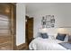 Cozy bedroom featuring a comfortable bed and artwork at 108 E Saint Clair St # E, Indianapolis, IN 46204