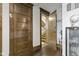 Entryway with dark hardwood floors, detailed trim, and access to upper floors at 108 E Saint Clair St # E, Indianapolis, IN 46204
