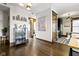 Hallway boasts hardwood floors and tasteful decor, leading to kitchen at 108 E Saint Clair St # E, Indianapolis, IN 46204