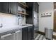 Well-equipped kitchen featuring stainless steel dishwasher, sink, and refrigerator at 108 E Saint Clair St # E, Indianapolis, IN 46204
