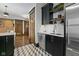 Well-appointed kitchen includes stainless steel appliances, sleek cabinetry, and stylish backsplash at 108 E Saint Clair St # E, Indianapolis, IN 46204