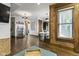 Open living space with exposed brick, hardwood floors, and modern lighting at 108 E Saint Clair St # E, Indianapolis, IN 46204