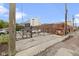 Gated parking area with an alley view and surrounding buildings at 108 E Saint Clair St # E, Indianapolis, IN 46204