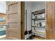 Well-organized storage room with shelving units and cleaning supplies at 108 E Saint Clair St # E, Indianapolis, IN 46204