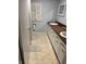 Traditional bathroom featuring double sinks with white cabinets and a wood-look countertop at 1122 Shelby St, Shelbyville, IN 46176