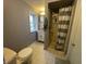 Simple bathroom with a stand up shower, white vanity, and neutral colors at 1122 Shelby St, Shelbyville, IN 46176
