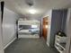 Cozy bedroom features a white bunk bed with storage, a ceiling fan, and a closet at 1122 Shelby St, Shelbyville, IN 46176