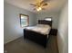 Bedroom with a large bed, ceiling fan, and window providing natural light at 1122 Shelby St, Shelbyville, IN 46176