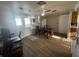 Bright dining room with hardwood floors, a dining table, and access to the kitchen at 1122 Shelby St, Shelbyville, IN 46176