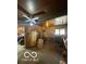 Spacious garage area with tools, storage, and workbench space at 1122 Shelby St, Shelbyville, IN 46176