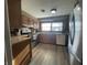 Functional kitchen featuring stainless steel appliances, wood cabinets, and ample counter space at 1122 Shelby St, Shelbyville, IN 46176